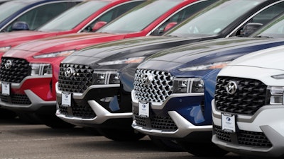 A line of 2022 Santa Fe SUV's sit outside a Hyundai dealership Sunday, Sept. 12, 2021, in Littleton, Colo. Nearly three months after Hyundai and Kia rolled out new software designed to thwart rampant auto thefts, crooks are still driving off with the vehicles at an alarming rate. (AP Photo/David Zalubowski