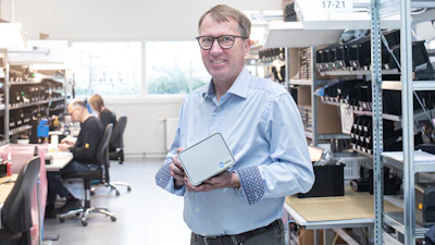 OnRobot CEO Enrico Krog Iversen showcasing the OR:BASE hardware at the heart of the D:PLOY platform.