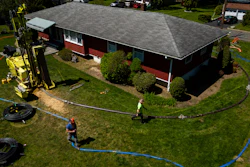 A drill rig for a geothermal heat pump sits outside a home in White Plains, N.Y., Monday, May 8, 2023.
