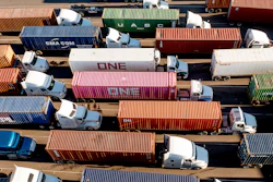 Trucks line up to enter a Port of Oakland shipping terminal on Nov. 10, 2021, in Oakland, Calif.