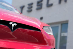 An unsold 2023 Model X sports-utility vehicle sits outside a Tesla dealership Sunday, June 18, 2023, in Littleton, Colo.