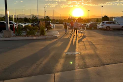 Shoppers head to their cars at a Costco in Sheridan, Colo., July 11, 2023.
