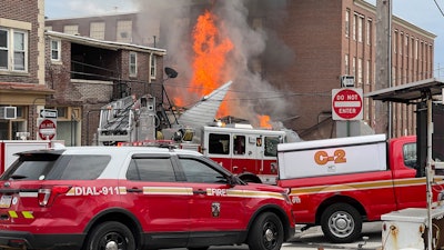 Emergency personnel work at the site of a deadly explosion at a chocolate factory in West Reading, Pa., March 25, 2023.