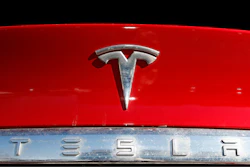 The Tesla company logo is shown at a Tesla dealership in Littleton, Colo., Feb. 2, 2020.