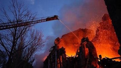 Emergency personnel work at the scene of a destroyed residential area in Mykolaiv, Ukraine, July 20, 2023.