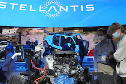 People look at the charging technology from the Jeep Wrangler 4xe at the Stellantis booth during the CES tech show Thursday, Jan. 6, 2022, in Las Vegas.
