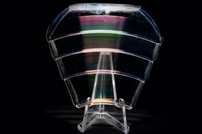 A diffractive lens bends light using etchings and patterns on its surface.