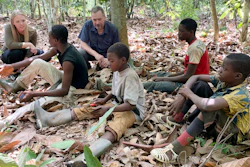 International Rights Advocates Executive Director Terrence Collingsworth and translator Melina Cardinal Bradette talk to children working on a cocoa plantation in Daloa, Ivory Coast, April 2020.