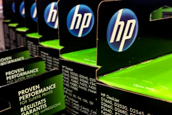 This Aug. 15, 2019, photo shows the HP logo on Hewlett-Packard printer ink cartridges at a store in Manchester, N.H.