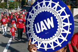 United Auto Workers members walk in the Labor Day parade in Detroit, Sept. 2, 2019.