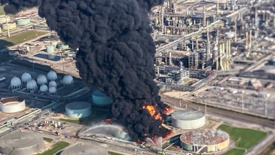 Smoke billows from a tank fire at the Marathon Petroleum facility in Garyville, La., Friday, Aug. 25, 2023.