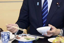 Japanese Prime Minister Fumio Kishida eats seafood from Fukushima prefecture in the prime minister's office, Tokyo, Aug. 30, 2023.