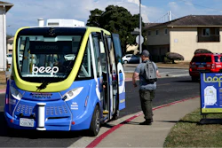A driverless shuttle stops for a passenger on San Francisco's Treasure Island as part of a pilot program to assess the safety and effectiveness of autonomous vehicles for public transit on Aug. 16, 2023.