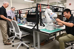 From left, Jim Noble, Mike Klote and Yi Wang from the University of Missouri College of Engineering examine equipment in one of the college's two existing manufacturing core labs.