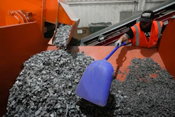 K.C. Skillern moves material with a shovel from recycled solar panels at We Recycle Solar on Tuesday, June 6, 2023, in Yuma, Ariz.