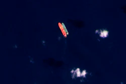 In this satellite photo provided by Planet Labs PBC, vessels identified as the Virgo, left, and the Suez Rajan, by the advocacy group United Against Nuclear Iran, are seen in the South China Sea on Feb. 13, 2022.