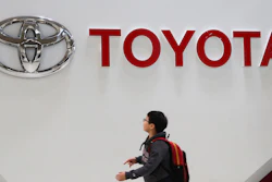 A boy looks at a logo of Toyota Motor Corp. at its gallery in Tokyo on Jan. 15, 2020.