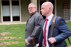 The former head of a Michigan marijuana licensing board Rick Johnson, left, walks with his attorney Nick Dondzila, outside federal court, Tuesday, April 25, 2023, in Grand Rapids, Mich.
