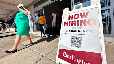 A hiring sign is displayed at a retail store in Vernon Hills, Ill., Thursday, Aug. 31, 2023.