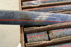 A core sample drilled from underground rock near Ely, Minn., shows a band of shiny minerals containing copper, nickel and precious metals, center, that Twin Metals Minnesota LLC, hopes to mine near the Boundary Waters Canoe Area Wilderness in northeastern Minnesota, Oct. 4, 2011.