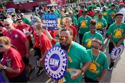 United Auto Workers members walk in the Labor Day parade in Detroit on Sept. 4, 2023.