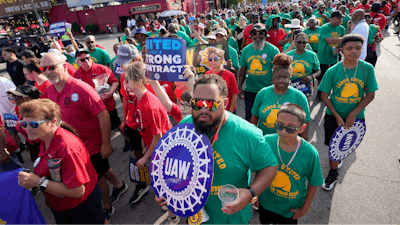 United Auto Workers members walk in the Labor Day parade in Detroit on Sept. 4, 2023.
