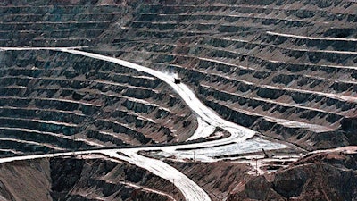 Terraces cut into the hillside at the huge Santa Rita copper mine in Grant County, N.M., are shown in this March 1999 file photo.