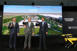 Chung Eui-sun, left, executive chairman of Hyundai Motor Group, Georgia Gov. Brian Kemp, and Jose Munoz, president and COO of Hyundai, celebrate with a champagne toast during the official groundbreaking for the Hyundai Meta Plant on Oct. 25, 2022 in Ellabell, Ga.