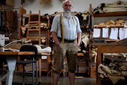 Saddler Klaus Bensmann works in his store in Bad Hindelang, Germany, Wednesday, Sept. 13, 2023. Bensmann produces tailored leather trousers and vests with hand embroidery.