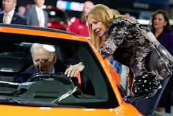 Mary Barra, CEO of General Motors, talks with President Joe Biden as he sits in a Corvette during a tour of the Detroit Auto Show on Sept. 14, 2022, in Detroit.