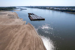 Barges float in the Mississippi River, St. Louis, Sept. 15, 2023.