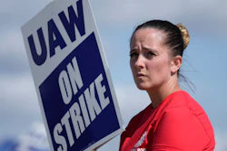 United Auto Workers member Victoria Hall walks the picket line at the Ford Michigan Assembly Plant in Wayne, Mich., Monday, Sept. 18, 2023.