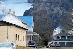 A black plume rises over East Palestine, Ohio, as a result of a controlled detonation of a portion of the derailed Norfolk Southern trains, Feb. 6, 2023.