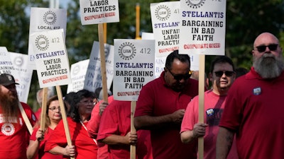 United Auto Workers march outside the Stellantis North American Headquarters, Wednesday, Sept. 20, 2023, in Auburn Hills, Mich.