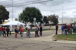 United Auto Workers picket outside the Flint Processing Center where multiple people were hit on Tuesday, Sept. 26, 2023, in Swartz Creek, Mich.