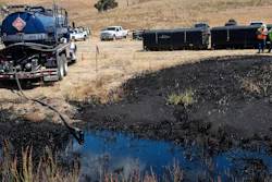 Workers monitor an underground oil pipe break up a hill from Refugio State Beach, north of Goleta, Calif., on May 20, 2015.