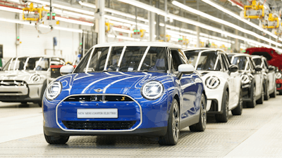 MINI cars stand in a row at the MINI plant at Cowley in Oxford, England, Monday, Sept. 11, 2023.