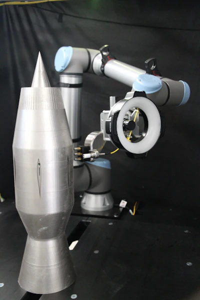 Vibrant REX PCRT system measuring resonance response of Ramjet. The REX platform enables additive manufacturers to measure a wide variety of part geometries with a single robotic test system.