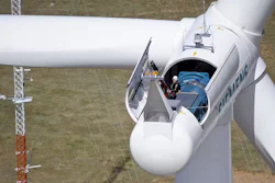 A technician makes adjustments to a wind turbine in Colorado.