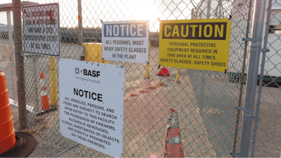 A gate at the entrance to the former Ciba Geigy chemical plant in Toms River, N.J. is posted with warning signs, Jan. 24, 2023, regarding the contaminated area, which is on the Superfund list of the nation's worst toxic waste sites.