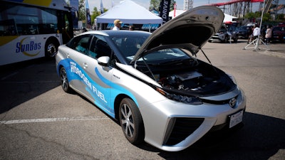 A 2021 Toyota Prius that runs on a hydrogen fuel cell sits on display at the Denver auto show on Sept. 17, 2021, at Elitch's Gardens in downtown Denver.