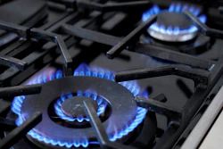 Burners on a natural gas stove in Walpole, Mass., June 21, 2023.