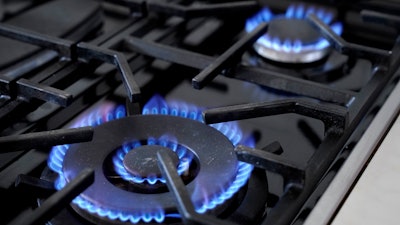 Burners on a natural gas stove in Walpole, Mass., June 21, 2023.