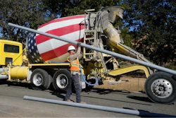 A truck drives past a Pacific Gas and Electric crew burying power lines in Vacaville, Calif., Wednesday, Oct. 11, 2023.