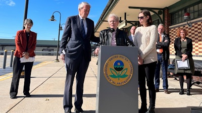 Massachusetts Sen. Edward Markey, left, stands in support of Anne Anderson, whose son died of leukemia in 1981 and was exposed to water contaminated with the chemical trichloroethylene, or TCE.