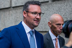 Trevor Milton, left, leaves the Thurgood Marshall United States Courthouse on Sept. 12, 2022, in New York. Nikola Corp. has been awarded $165 million in an arbitration proceeding with its founder and former executive chairman, according to a regulatory filing.