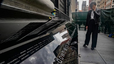 Fine artist Cushla Naegele visits the Triangle Shirtwaist Memorial, a day before its official ceremonial opening, Tuesday, Oct. 10, 2023, in New York.