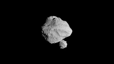This photo provided by NASA shows a photo taken by the Lucy spacecraft during Wednesday, Nov. 1, 2023 flyby of asteroid Dinkinesh, 300 million miles from Earth. It turns out Dinkinesh, which is only a half-mile across, has a dinky sidekick ... just one-tenth of a mile across.