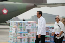 Indonesian President Joko Widodo, left, and Foreign Minister Retno Marsudi inspect relief supplies for Gaza at Halim Perdanakusuma air base, Jakarta, Nov. 4, 2023.