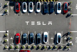 Tesla vehicles line a parking lot at the company's Fremont, Calif., factory, on Sept. 18, 2023.